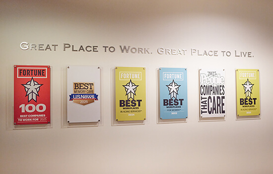 Award plaques adorn the wall inside a Brightview Senior Living community.