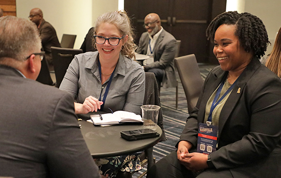 NASPO members in discussion at a conference.