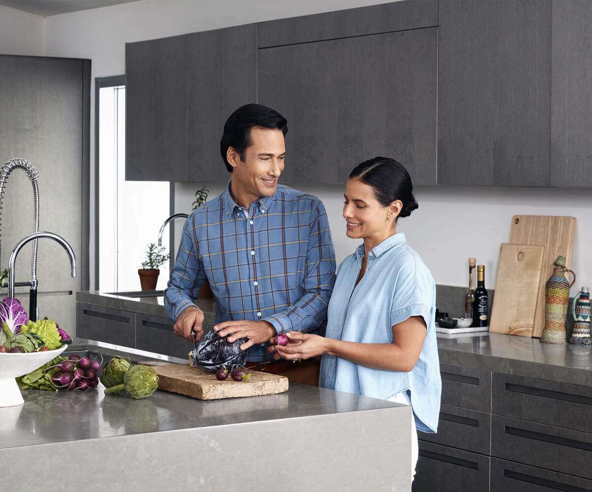 couple preparing meal in kitchen